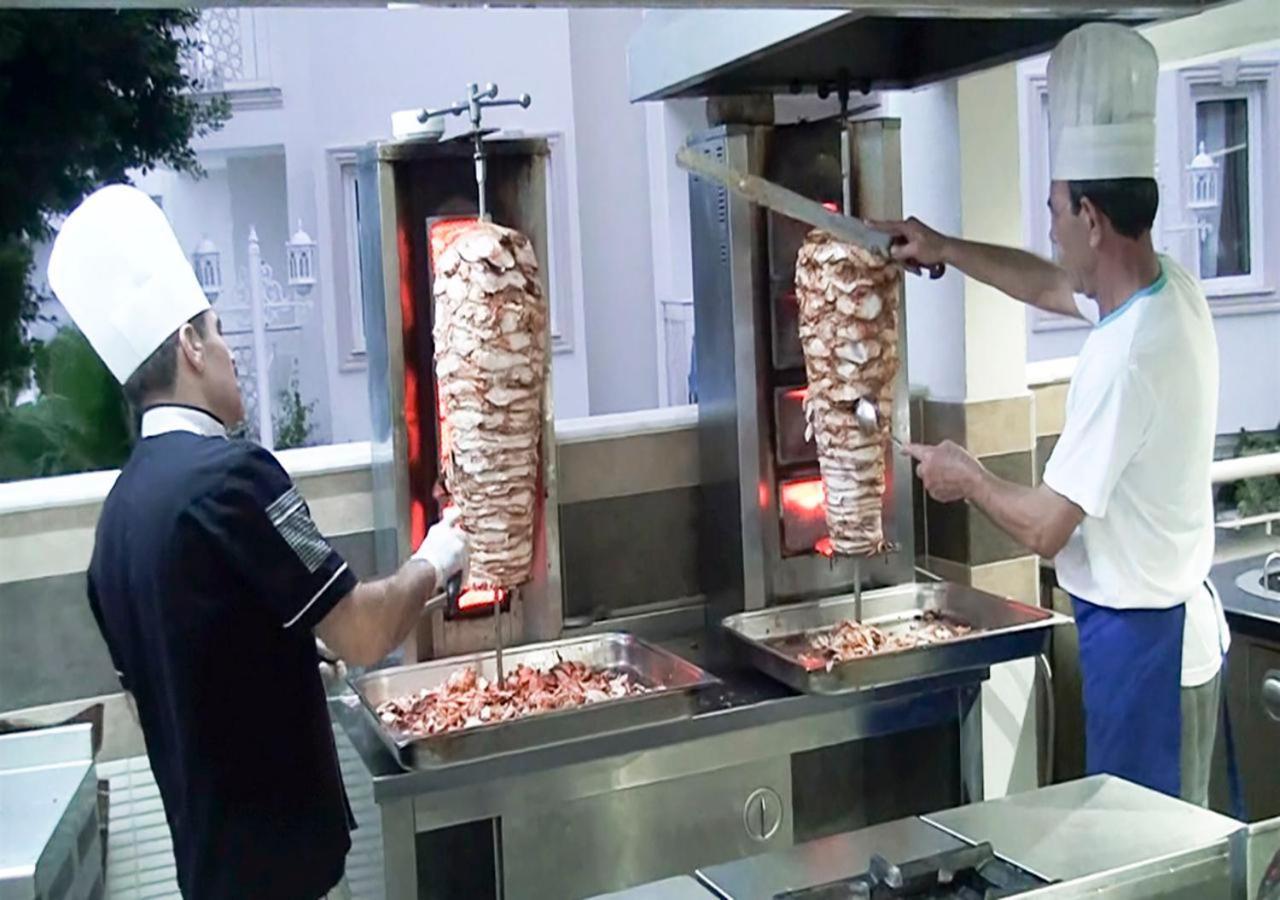 Golden Sunset Hotel&Spa كمر المظهر الخارجي الصورة Gyros being prepared